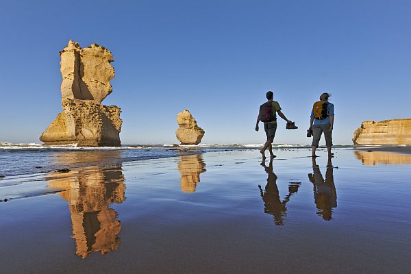 Couple hike past the Twelve Apostles