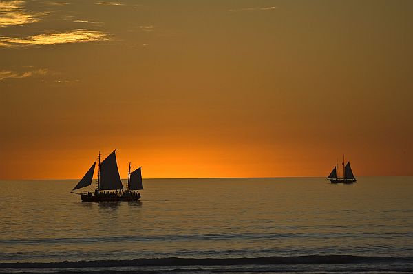 Pearl luggers at dusk off Cable Beach, in Broome
